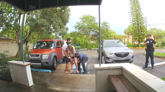 Midwife Aids Baby Delivery in Parking Lot